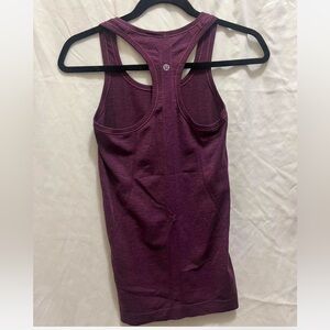 Purple lululemon athletic tank top.